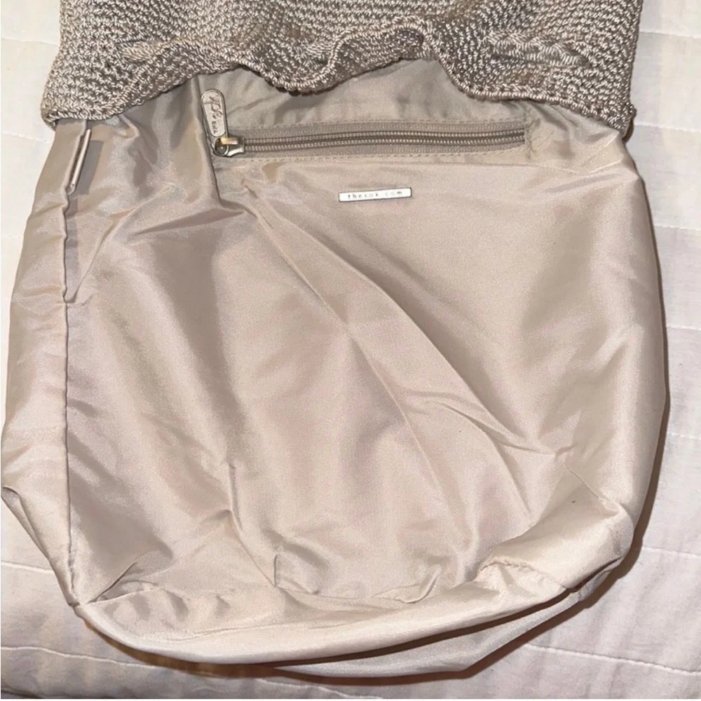 The Sak sling Backpack in the color mushroom